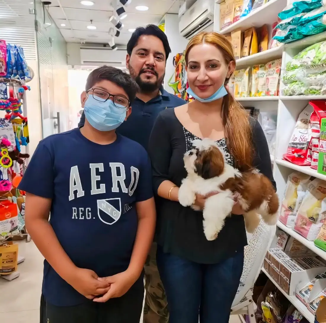 A FancyPaws puppy with its new family